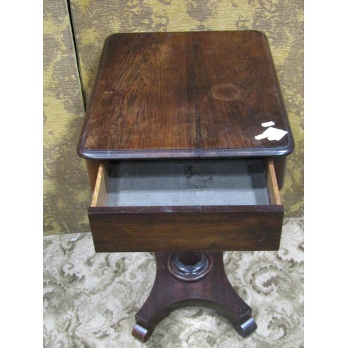 1143 - A 19th century rosewood table of rectangular form with frieze drawer raised on a tapered octagonal p... 