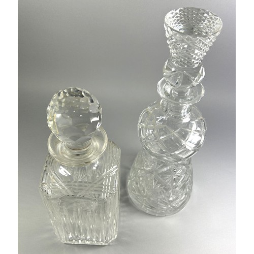 174 - A pair of cut glass decanters, one as a stylised thistle