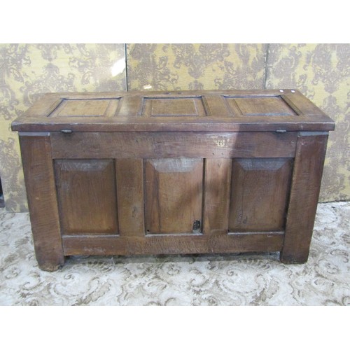 1145 - An 18th century oak coffer with hinged lid and rectangular fielded panels 68 cm high x 125 cm x 54 c... 