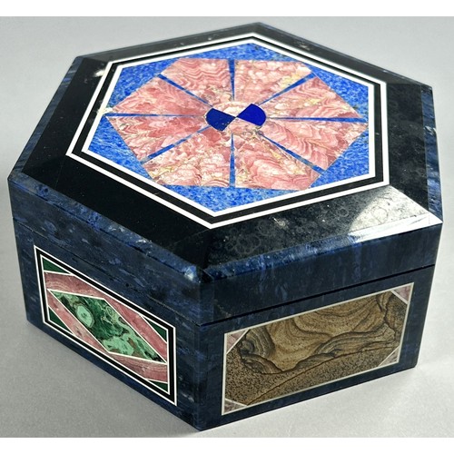 411 - A contemporary Pietra Dura jewel box of hexagonal outline, 10 cm diameter