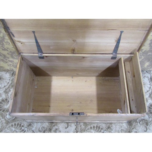 1153 - A 19th century stripped pine blanket box with hinged lid, exposed dovetail construction and drop sid... 