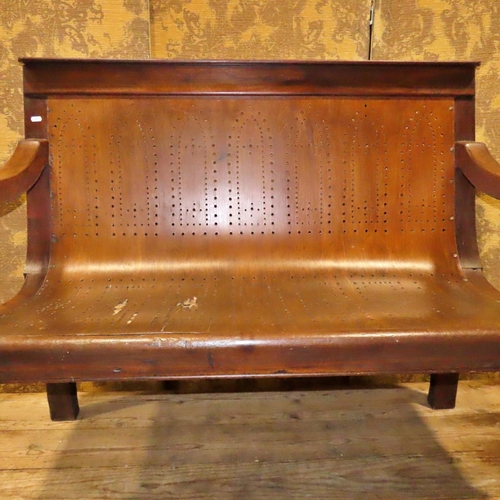 1154 - A Victorian mahogany waiting room bench with pierced plywood seat raised on turned tapered forelegs ... 