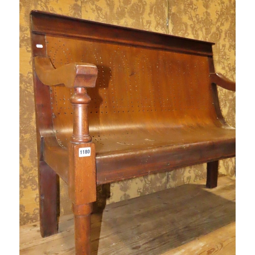 1154 - A Victorian mahogany waiting room bench with pierced plywood seat raised on turned tapered forelegs ... 