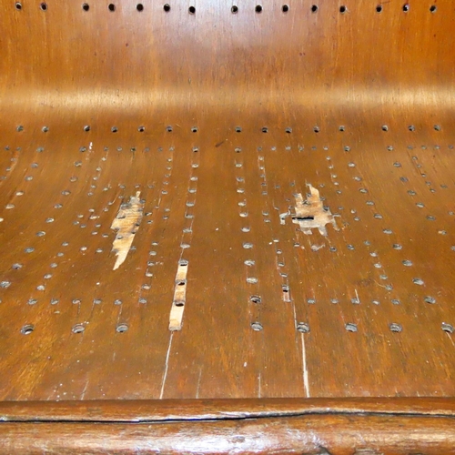 1154 - A Victorian mahogany waiting room bench with pierced plywood seat raised on turned tapered forelegs ... 