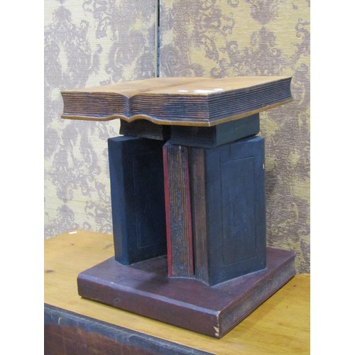 1156 - A novelty wooden occasional table in the form of a stack of books, 50 cm high x 40 cm square