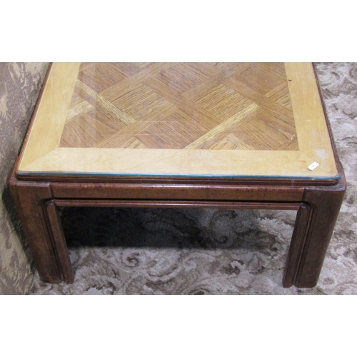 1157 - A contemporary low occasional table of rectangular form with oak veneered parquet top raised on moul... 