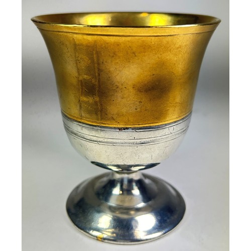 409 - A pewter and brass mounted goblet in a simple mediaeval style, 20th century, with soft drawstring ba... 