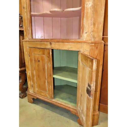 1170 - A Georgian stripped pine two sectional freestanding corner cupboard partially enclosed  by a pair of... 