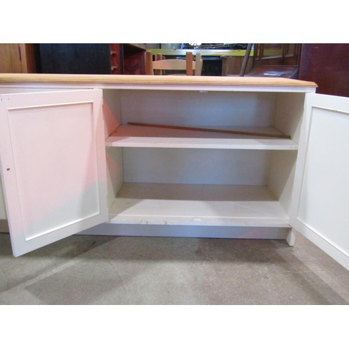 1172 - A kitchen dresser base partially painted and enclosed by an arrangement of cupboards and two drawers... 