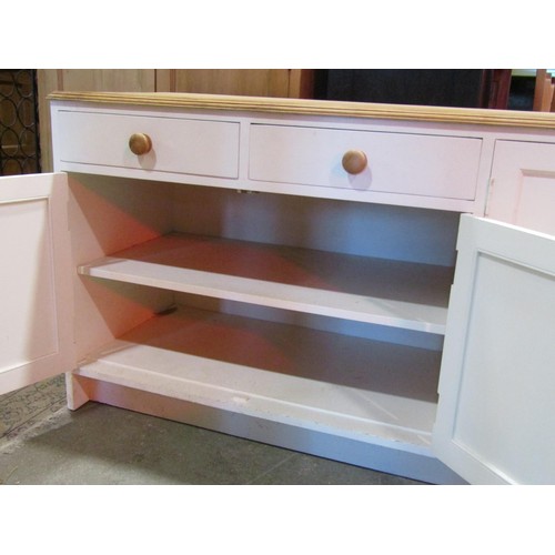 1172 - A kitchen dresser base partially painted and enclosed by an arrangement of cupboards and two drawers... 