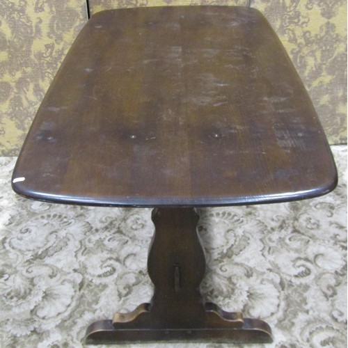 1181 - A vintage Ercol dark stained elm refectory table together with a set of six associated Ercol hoop an... 