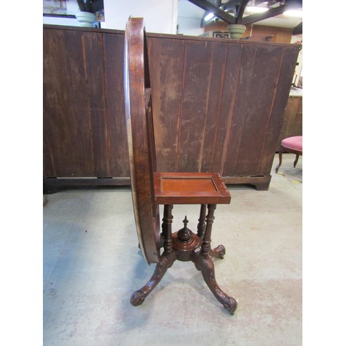 1215 - A Victorian figured and burr walnut veneered tilt top breakfast table of oval form with inlaid detai... 