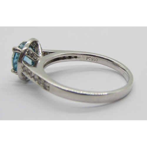 347 - 950 platinum blue topaz and diamond halo cluster ring, the diamonds 0.02ct each approx, maker 'XM', ... 