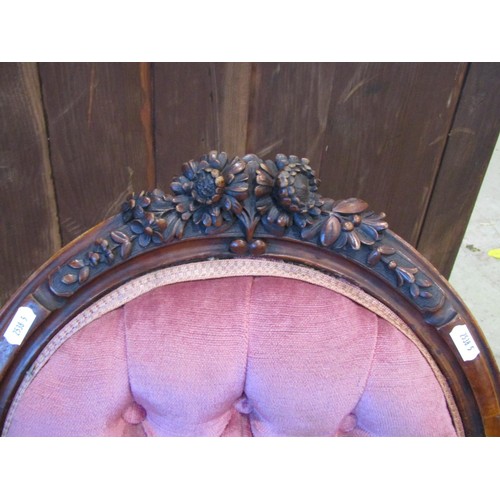 1198 - A pair of Victorian chairs with upholstered seats and buttoned cameo shaped backs within walnut show... 