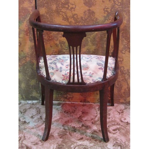 1265 - An Edwardian mahogany light weight tub chair, the horseshoe shaped back with pierced splats and upho... 