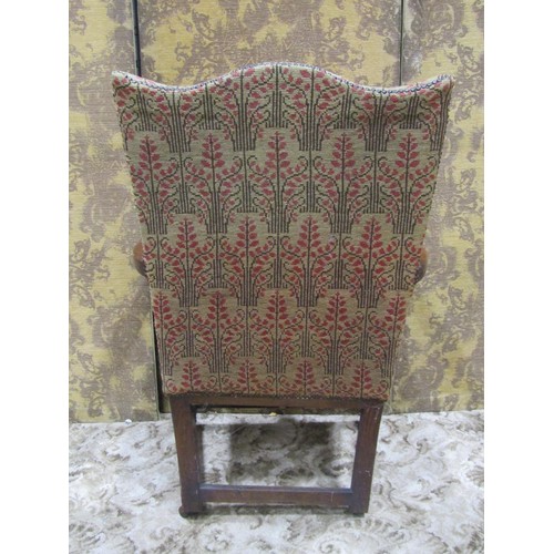 1272 - A 19th century open armchair with tapestry upholstery and shield shaped back, raised on turned suppo... 