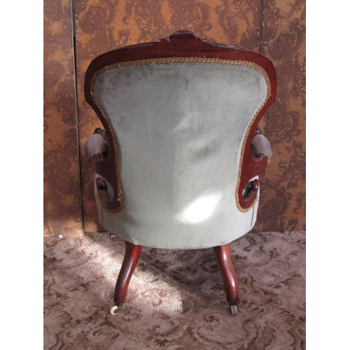 1276 - A Victorian drawing room chair with upholstered seat and button back with show wood frame