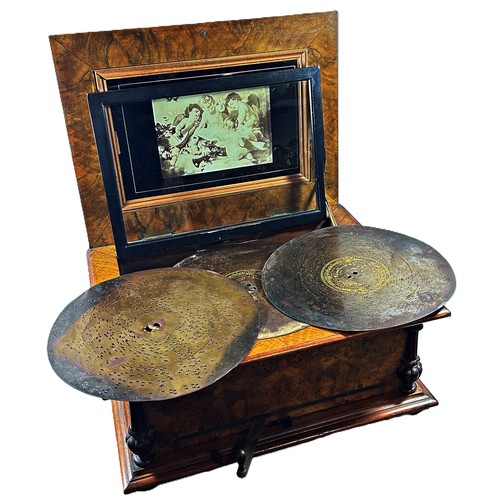 464 - An early 20th century German Polyphon or Symphonium walnut disc musical box with musical cherubs to ... 