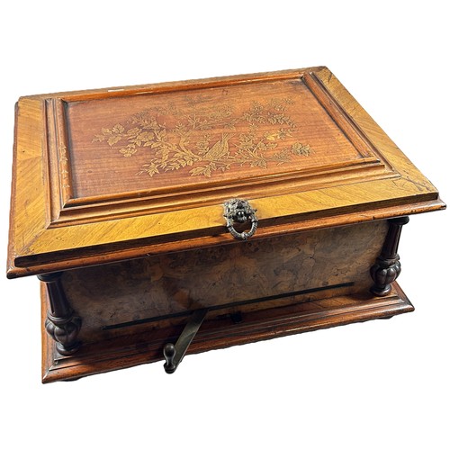 464 - An early 20th century German Polyphon or Symphonium walnut disc musical box with musical cherubs to ... 