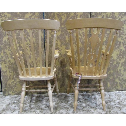 1278 - A modern Windsor beechwood armchair with pierced fiddle shaped splat, together with a further simila... 