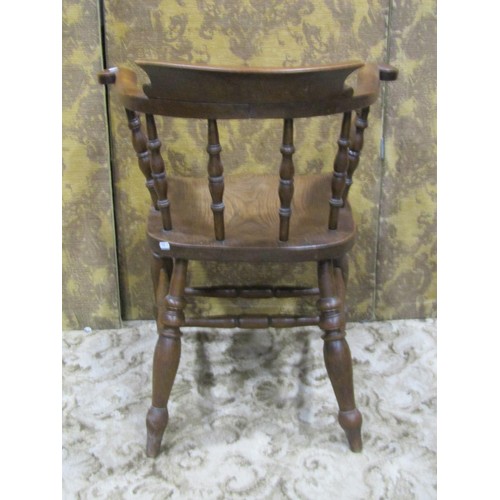 1281 - A late 19th century smokers bow elbow chair with turned spindle back