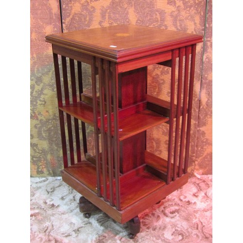 1283 - An inlaid Edwardian mahogany floorstanding revolving bookcase of square cut form, 87cm high x 45cm s... 