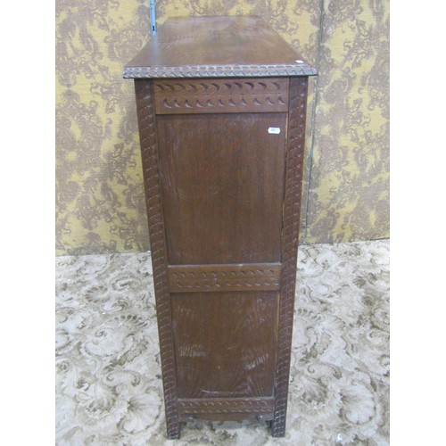 1284 - An antique oak free standing open bookcase with three adjustable shelves and repeating carved border... 