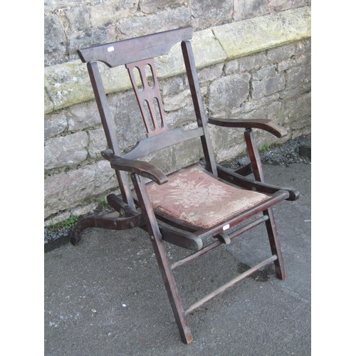 1202 - An Edwardian folding chair with pierced splat and upholstered pad seat together with a chip carved o... 