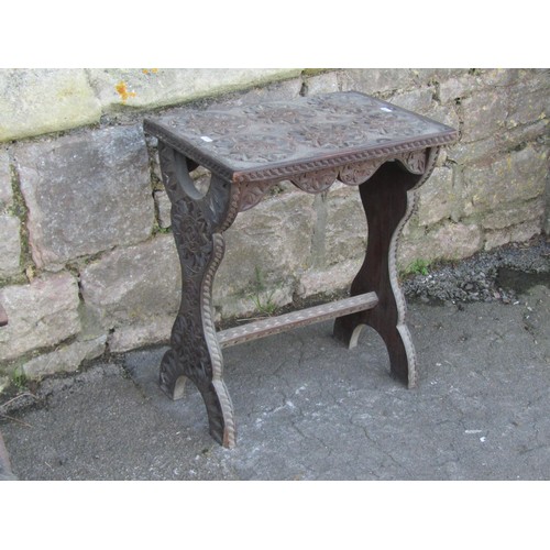 1202 - An Edwardian folding chair with pierced splat and upholstered pad seat together with a chip carved o... 