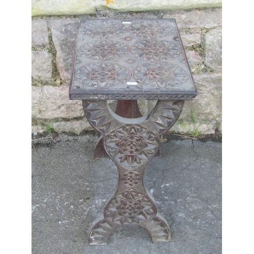 1202 - An Edwardian folding chair with pierced splat and upholstered pad seat together with a chip carved o... 