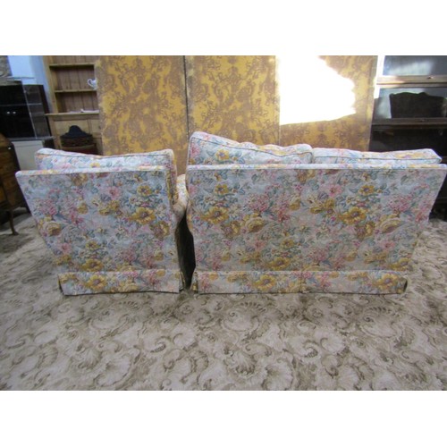 1294 - A traditional two seat sofa and matching armchair with rolled arms, floral printed upholstery with l... 