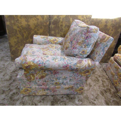 1294 - A traditional two seat sofa and matching armchair with rolled arms, floral printed upholstery with l... 