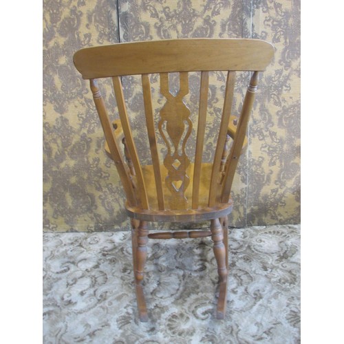 1295 - A modern Windsor beechwood fiddleback rocking chair