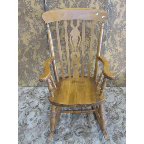 1295 - A modern Windsor beechwood fiddleback rocking chair