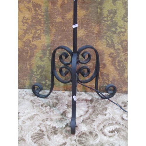 1313 - An adjustable iron work standard lamp with scrolled detail, 164cm high