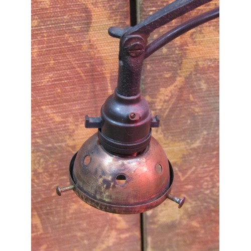 1313 - An adjustable iron work standard lamp with scrolled detail, 164cm high