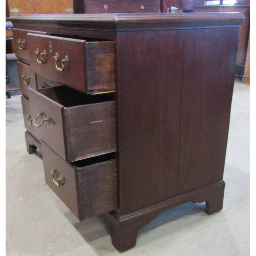 1222 - A Georgian oak dresser base enclosed by an arrangement of six drawers flanking a cupboard enclosed b... 