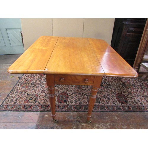 1327 - A large Victorian satin birch Pembroke table on turned supports 75H x 116L x 50W (when closed), 100W... 