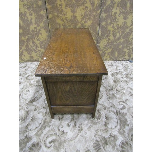 1338 - A reproduction oak coffer with hinged lid and moulded panelled frame, 56cm high x 105cm x 45cm