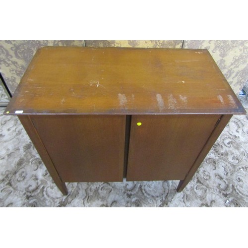 1230 - A mid century teak office side cupboard enclosed by a pair of rectangular doors, with shelved interi... 