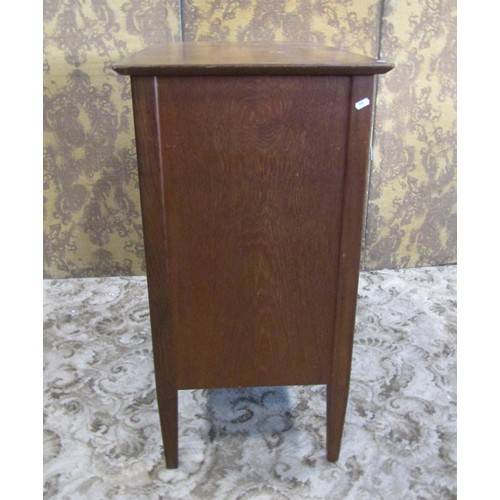 1230 - A mid century teak office side cupboard enclosed by a pair of rectangular doors, with shelved interi... 