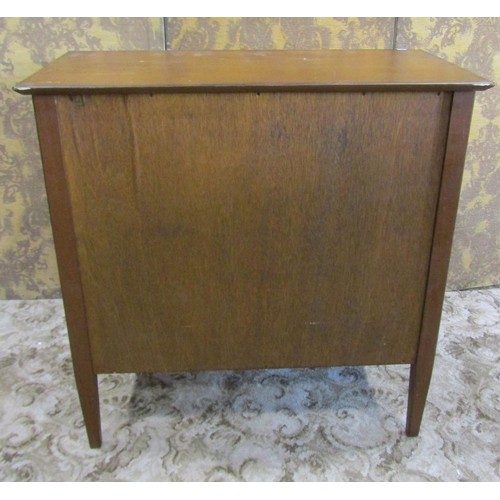 1230 - A mid century teak office side cupboard enclosed by a pair of rectangular doors, with shelved interi... 