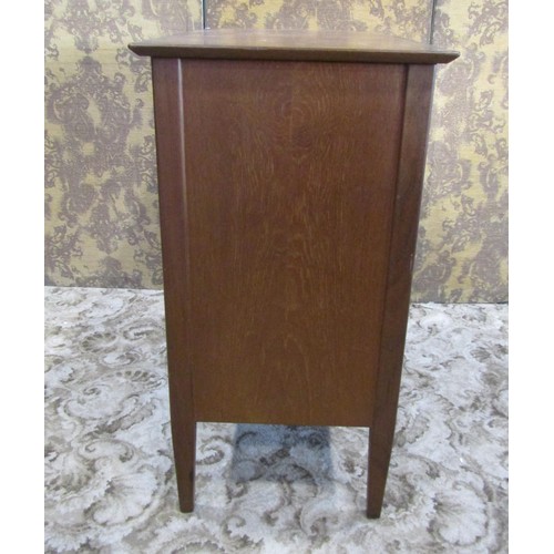 1230 - A mid century teak office side cupboard enclosed by a pair of rectangular doors, with shelved interi... 