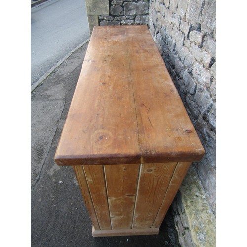 1347 - A stripped and waxed pine kitchen dresser base enclosed by three doors and two frieze drawers, 100cm... 