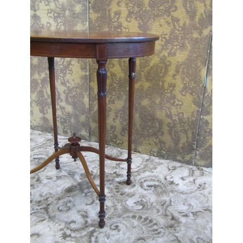 1249 - A good quality inlaid Edwardian mahogany occasional table of oval form raised on four slender turned... 