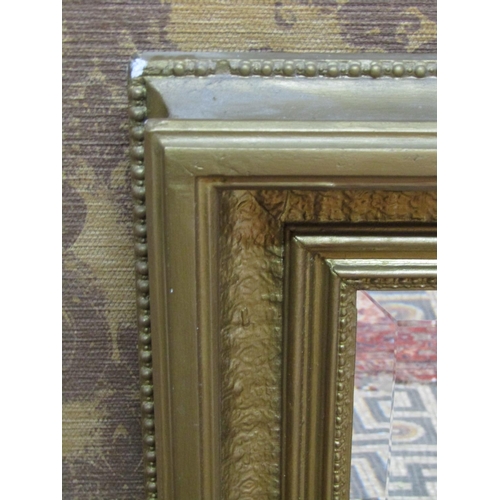 1358 - A 19th century overgilded rectangular stepped and cushion moulded frame, 78 cm x 108 cm enclosing a ... 