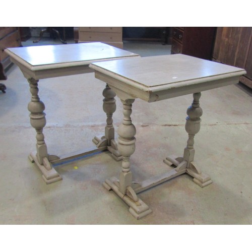 1254 - A pair of oak occasional tables with later painted finish, the rectangular tops raised on turned sup... 