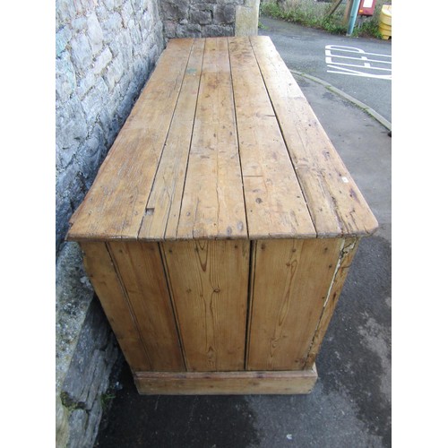 1373 - A substantial Victorian stripped and waxed pine dresser base, partially enclosed by a pair of panell... 