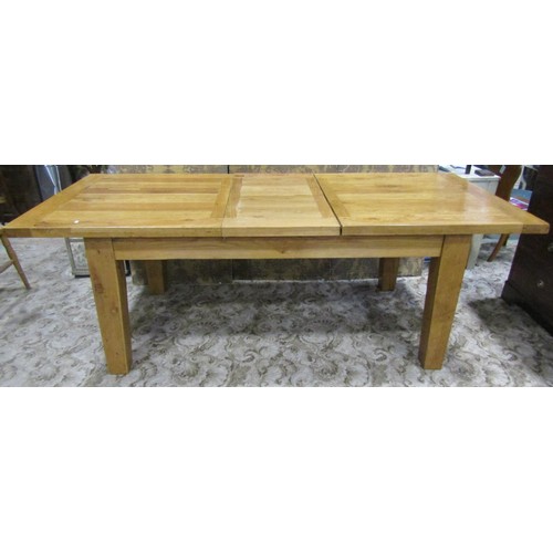 1124 - A contemporary rustic oak extending dining table of rectangular form, with single additional leaf, r... 