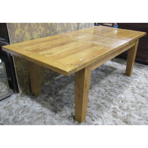 1124 - A contemporary rustic oak extending dining table of rectangular form, with single additional leaf, r... 